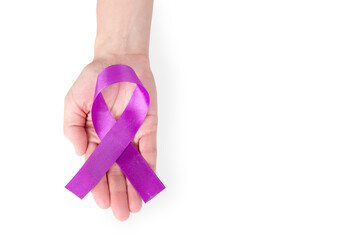 Purple satin ribbon on the palm of a woman, isolated on a white background. Cancer awareness...