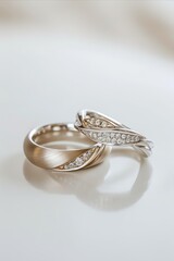 wedding rings with diamonds on a white background close-up
