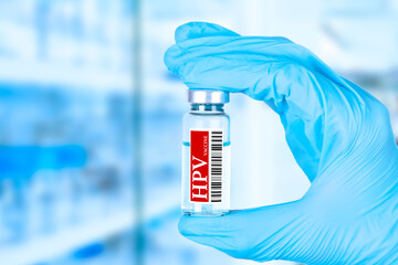 Vaccine against human papillomavirus, HPV. medical ampoule in the hands of a doctor. Vaccination...