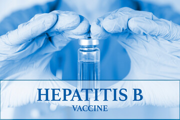 Hepatitis B vaccine. medical ampoule in the hands of a doctor. Vaccination awareness concept. Toned image. Soft blurred background. Medical poster.