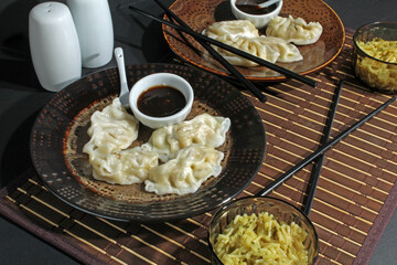Chinese chicken filled dumplings and teriyaki sauce, served with chicken fried rice