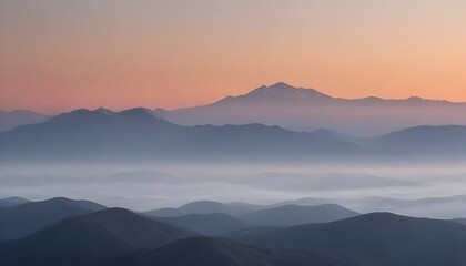 Sunrise Over a Range of Misty Mountains with a Gradient Sky