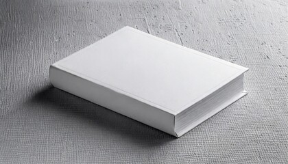 mockup of closed blank square book at white textured paper