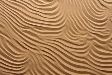 Fototapeta na wymiar abstract aesthetic wavy pattern on sand top view, sand ripples background