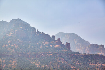 Fototapeta na wymiar Sedona Red Rock Mountains with Hazy Sky Perspective