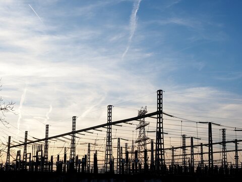 Electrical substation silhouette. Power plant at sunset