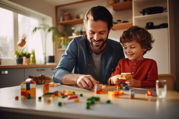 Family and childhood concept. A boy and a man play with legos. Father and son with a constructor. Dad and child build with plastic cubes - Powered by Adobe