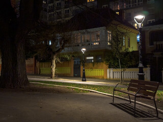 Solitude in the City: A Quiet Park Bench at Night