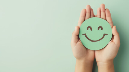 Hands holding green happy smile face , good feedback rating, positive customer review. - obrazy, fototapety, plakaty