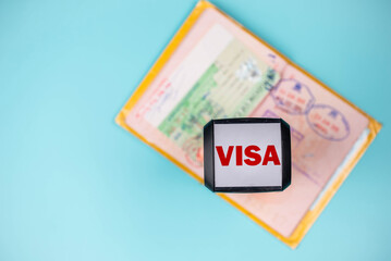 Travel passport pages with different countries Visa stamps, stamper and plane. Immigration, emigration, visa application and tourism concept.