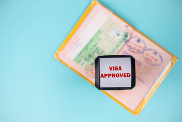 Travel passport pages, different countries Visa stamps, stamper “Approved” and plane. Immigration, emigration, visa application and tourism concept.