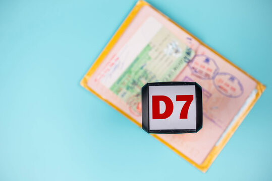 Travel passport pages, different countries stamps, stamper &ldquo;D7 Visa&rdquo; and plane. Immigration, emigration, visa application and tourism concept.