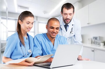 Doctors teamwork collaboration with documents in hospital