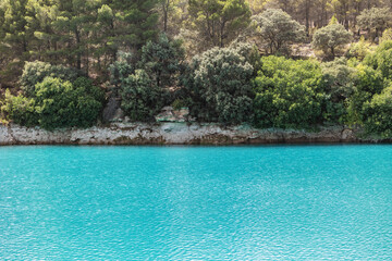 Lagunas de Ruidera located in Albacete Spain, with turquoise waters and blue sky