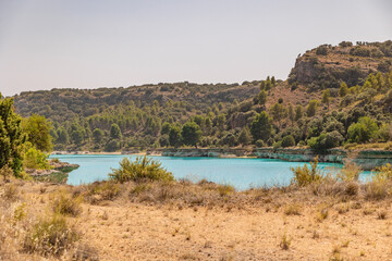 Fototapeta na wymiar Lagunas de Ruidera located in Albacete Spain, with turquoise waters and blue sky