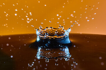 Water Droplet Crown with Golden Backdrop, High-Speed Side View