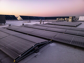 Solar panels in frost at dawn
- 729585831