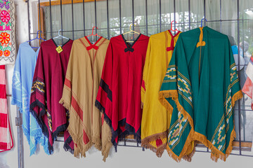Traditional Argentine ponchos at a street stall.