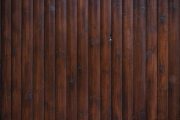 Texture of a panel of wooden logs. Wooden background.