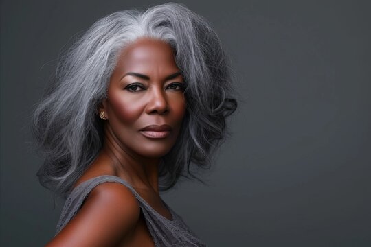 Beautiful African American Woman With Silver Hair On Grey Background