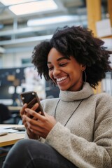 Portrait of smiling african american woman using mobile phone in office