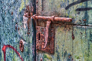Iron bolt on wooden door.