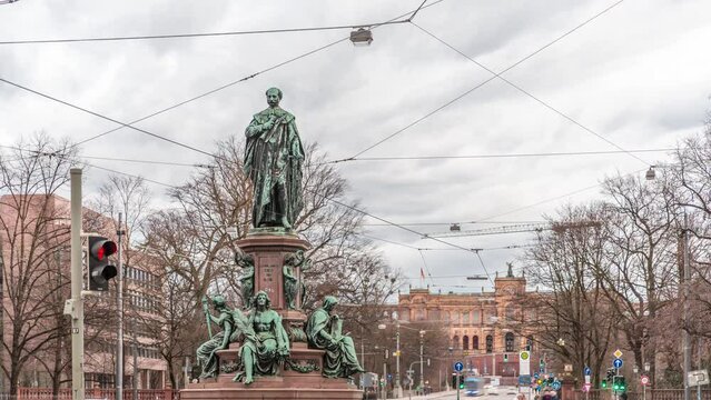 Maxmonument, Monument of Maximilian II of Bavaria timelapse, Maximilianstrasse street, Munich, Bavaria, Germany, Europe. Traffic on the road with tram rails. Maximilianeum building on a background