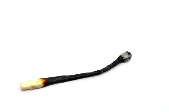 one burnt match on a white background