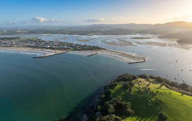 Aerial: Harbour and sandspit in Omaha Beach, Warkworth, New Zealand.