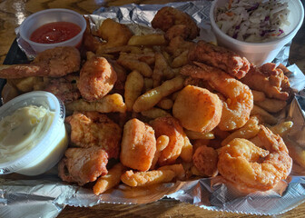 Fried shrimp and french fry dinner with coleslaw and tartar sauce