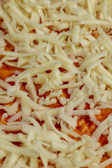 pizza dough with cheese and ketchup