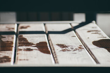 drops of water on a bench after rain