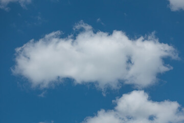 Fototapeta na wymiar Lonely White Cloud In The Blue Sky