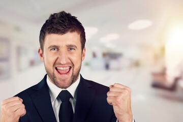 Young happy man winner gesture for celebrate