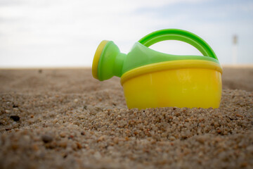Fototapeta na wymiar toys on the beach over the sand