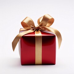 Red gift with gold bow on white background. Gifts as a day symbol of present and love.