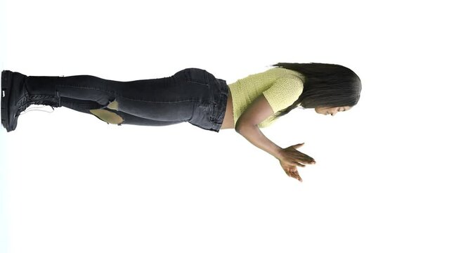 A woman, on a white background, in full height, claps