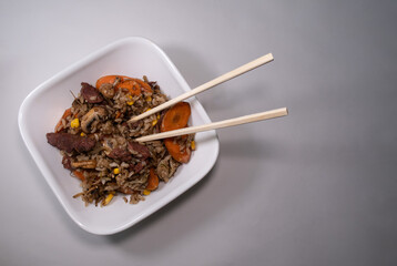 Freshly made Chinese fried rice with meat and vegetables, with space for text