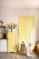 Modern Kitchen Interior with Island, Sink, Cabinets, and Big Window in New Luxury Home Decorated With Flowers