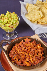 Authentic Mexican Cuisine with Grilled Meat, Guacamole, and Chips