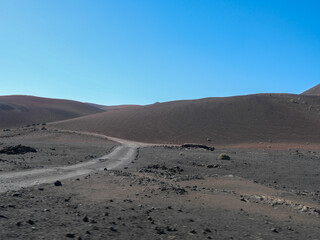 The volcanic mountain landscape of Lanzarote, Spain, under a clear sky