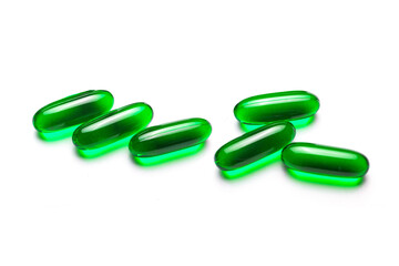 Medicine background. Green pills isolated on white. Pile of capsules. Tablets background. Vibrant vivid color drugs. Antibiotics background. Group of drugs. Pharmacy virus cure. Transparent medicine.