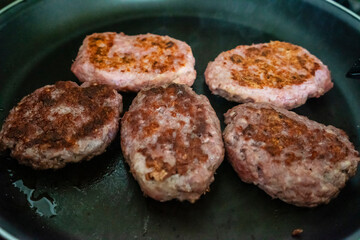 hamburgers toasting on a grill, mallorca, spain