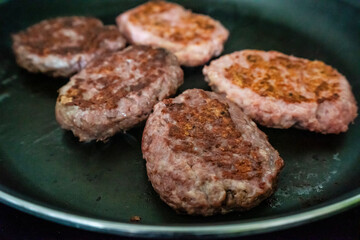 hamburgers toasting on a grill, mallorca, spain