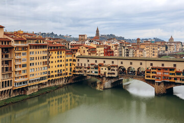 Fototapeta na wymiar View of the Arno River in Florence and the famous Ponte Vecchio (Old Bridge).