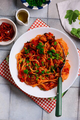 Spaghetti with tomato sauce and mussels.top view