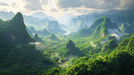  an aerial view of a mountain range with a valley in the foreground and a river running through the middle of the valley in the middle of the foreground.