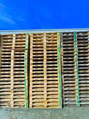 stack of wooden pallets for logistic shipments
