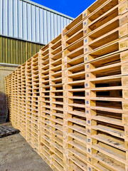 stack of wooden pallets for logistic shipments
