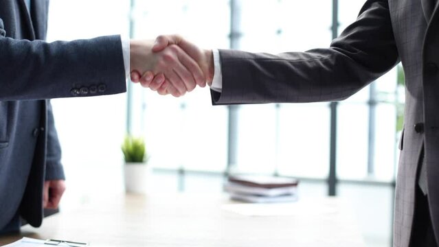 Congratulations on a successful deal with a handshake